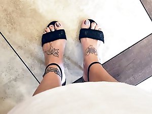 A well-endowed older woman is pleasuring herself