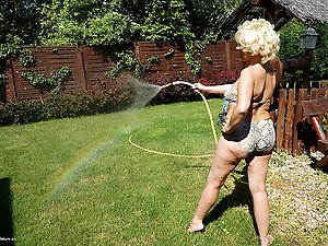 Horny blonde mature woman getting naughty in her garden