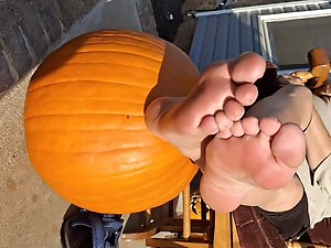 Pumpkin sitting on a footstool