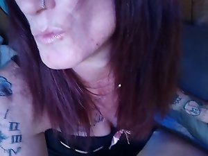 A mature woman is opening her mouth wide